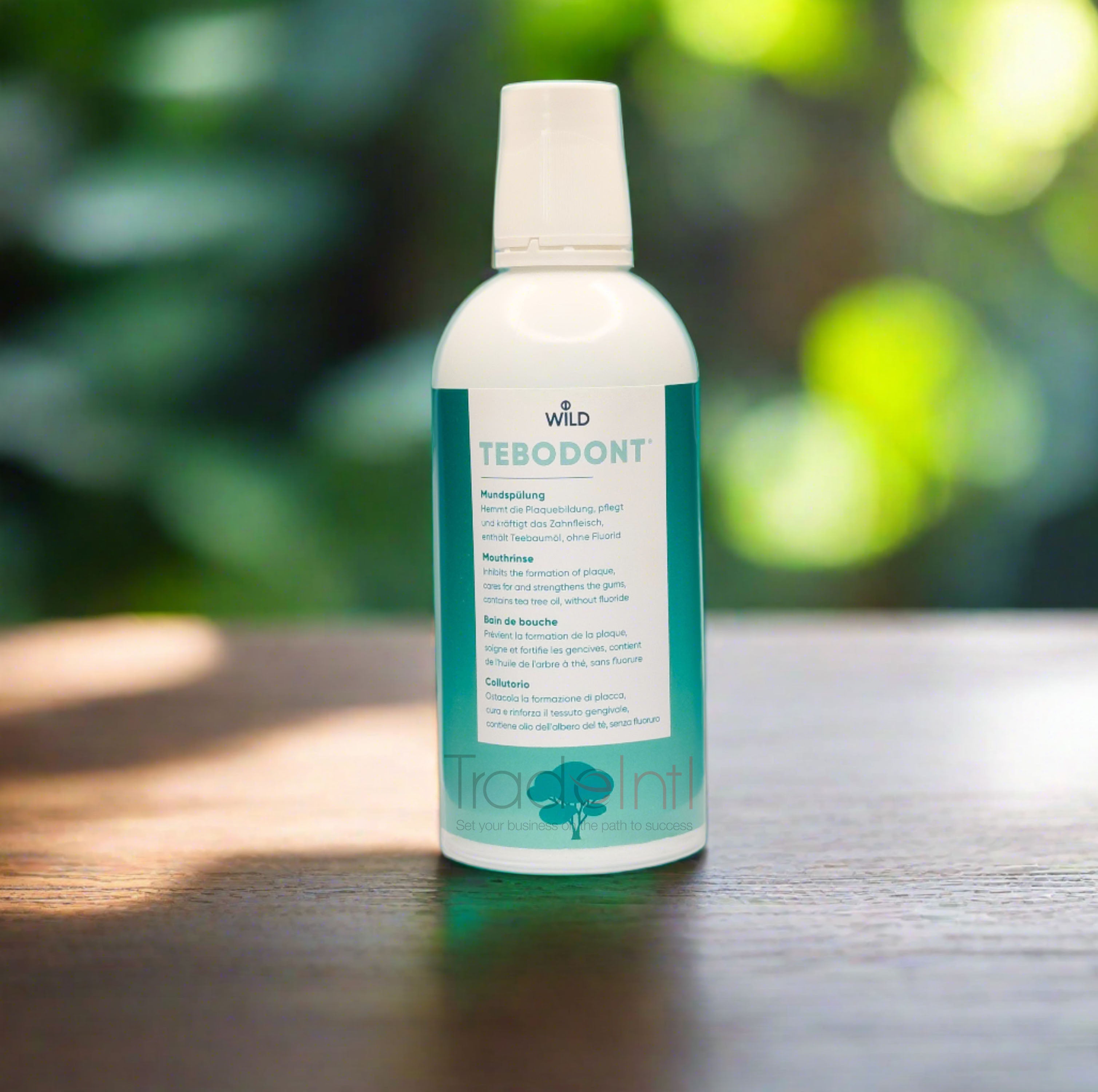 Tebodont dental product bottle with white cap on a nature background